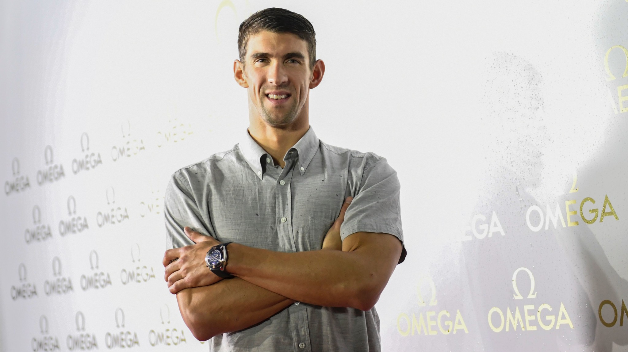 Michael phelps pose for photographers at an omega promotional event in rio de janeiro, brazil, august 15, 2016. Afp photo/ martin bernetti michael phelps ended his swimming legend's career with 23 olympic gold medals at the rio games. / afp / martin bernetti (photo credit should read martin bernetti/afp/getty images)