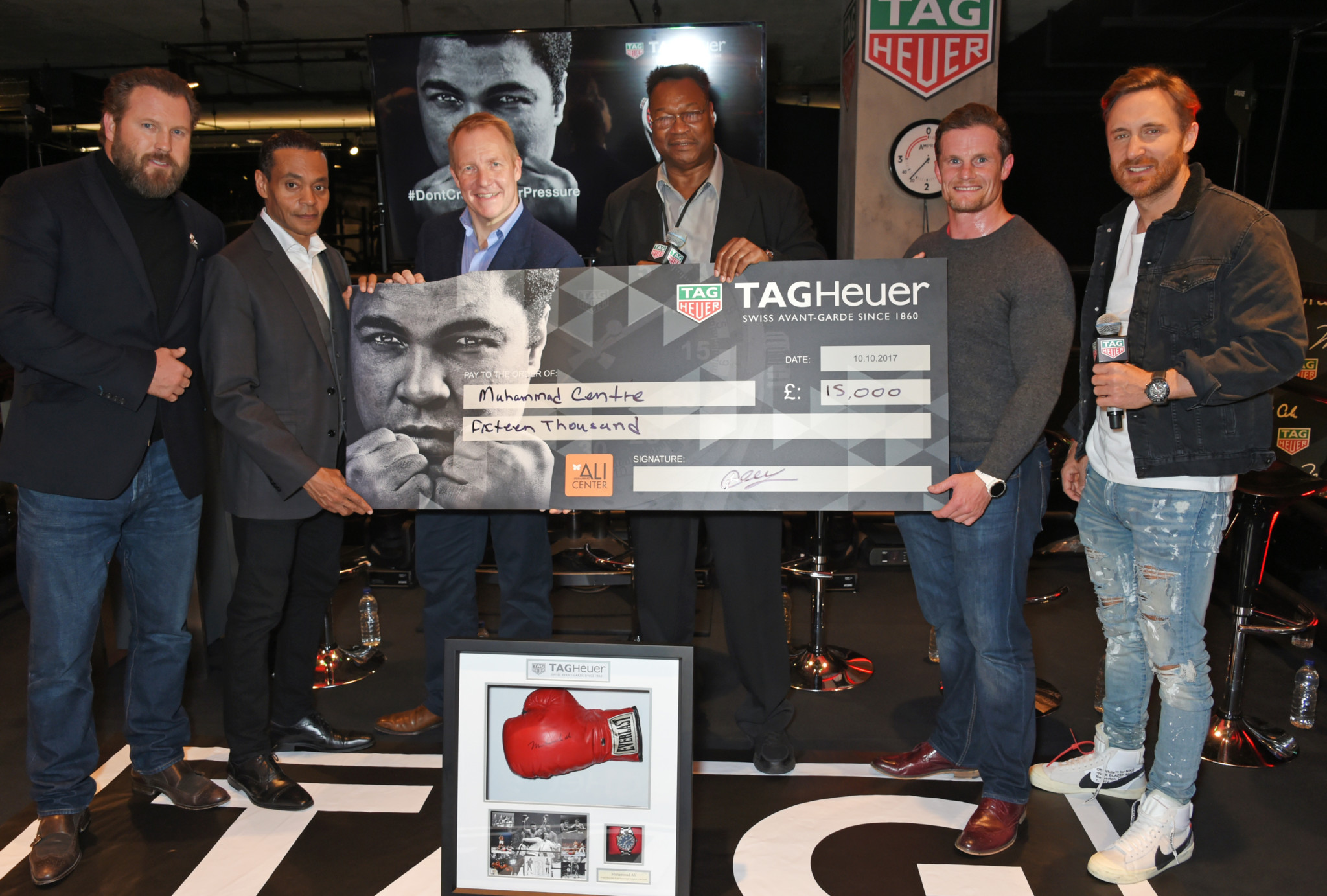 (l to r) scott welch, chairman of the world boxing council, donald e. Lassere, ceo of the muhammad ali center, larry holmes, guest and david guetta attend the launch of the tag heuer muhammad ali limited edition timepieces.