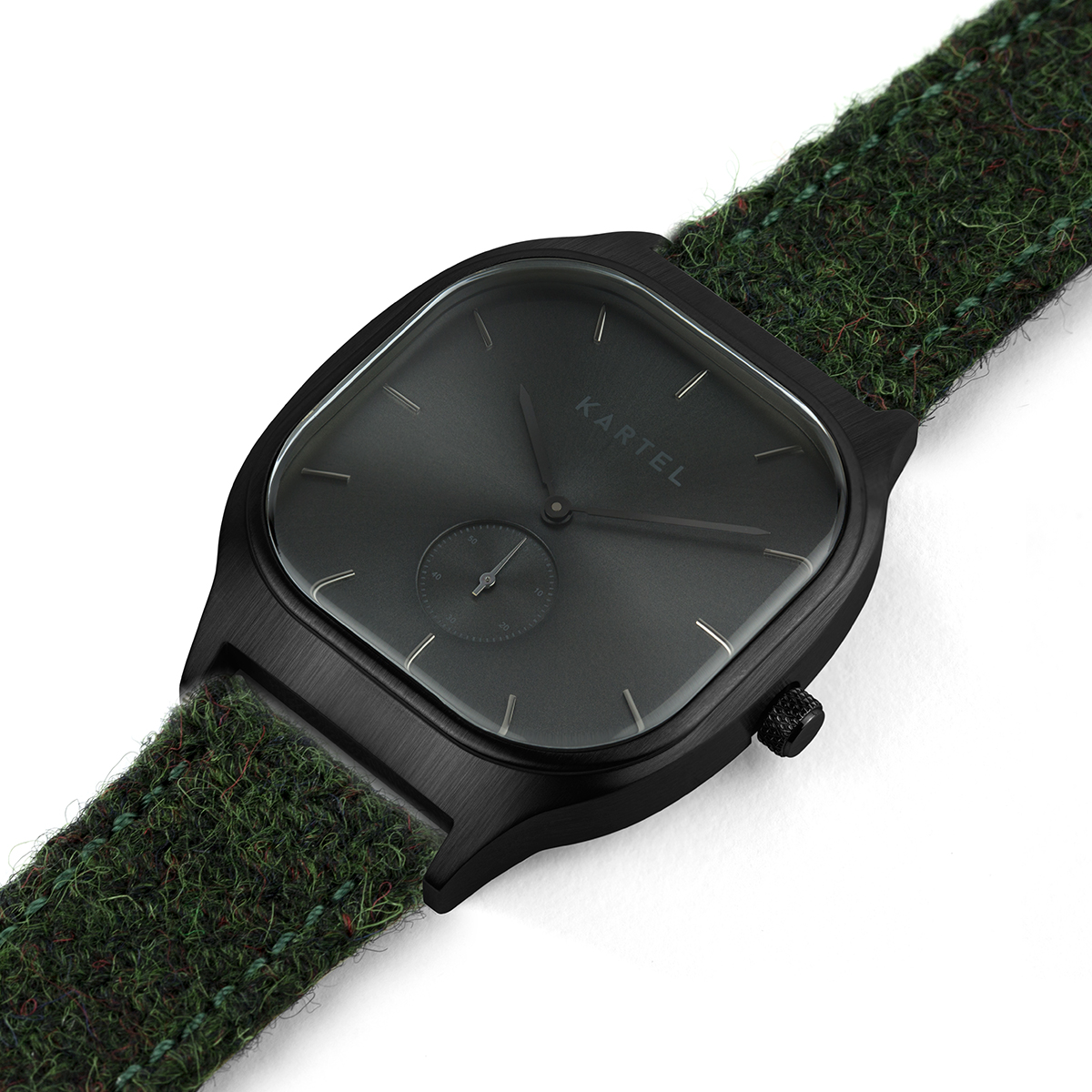 Kartel sinclair with a black dial on a green harris tweed strap.