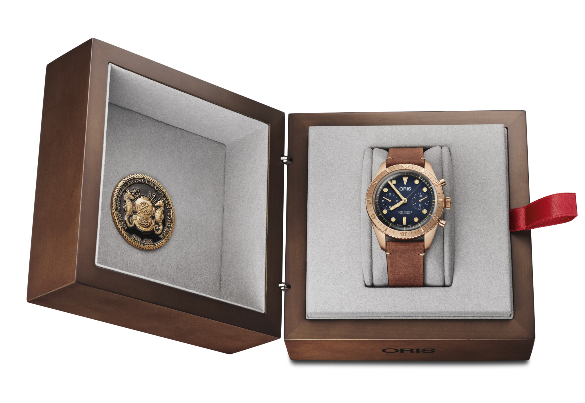 The watch comes in a wooden presentation box, complete with a coin issued by the carl brashear foundation