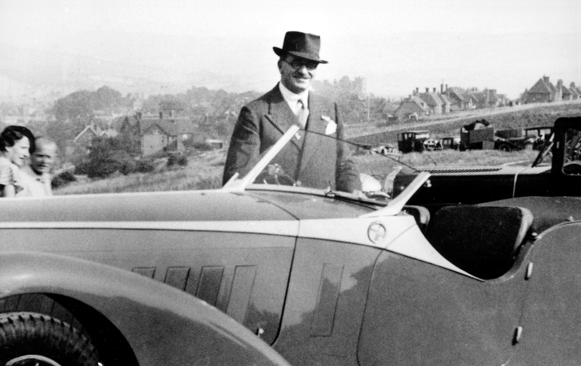 Lieut. Col. W. L. Sorel beside a bugatti type 57. Photo credit the bugatti trust