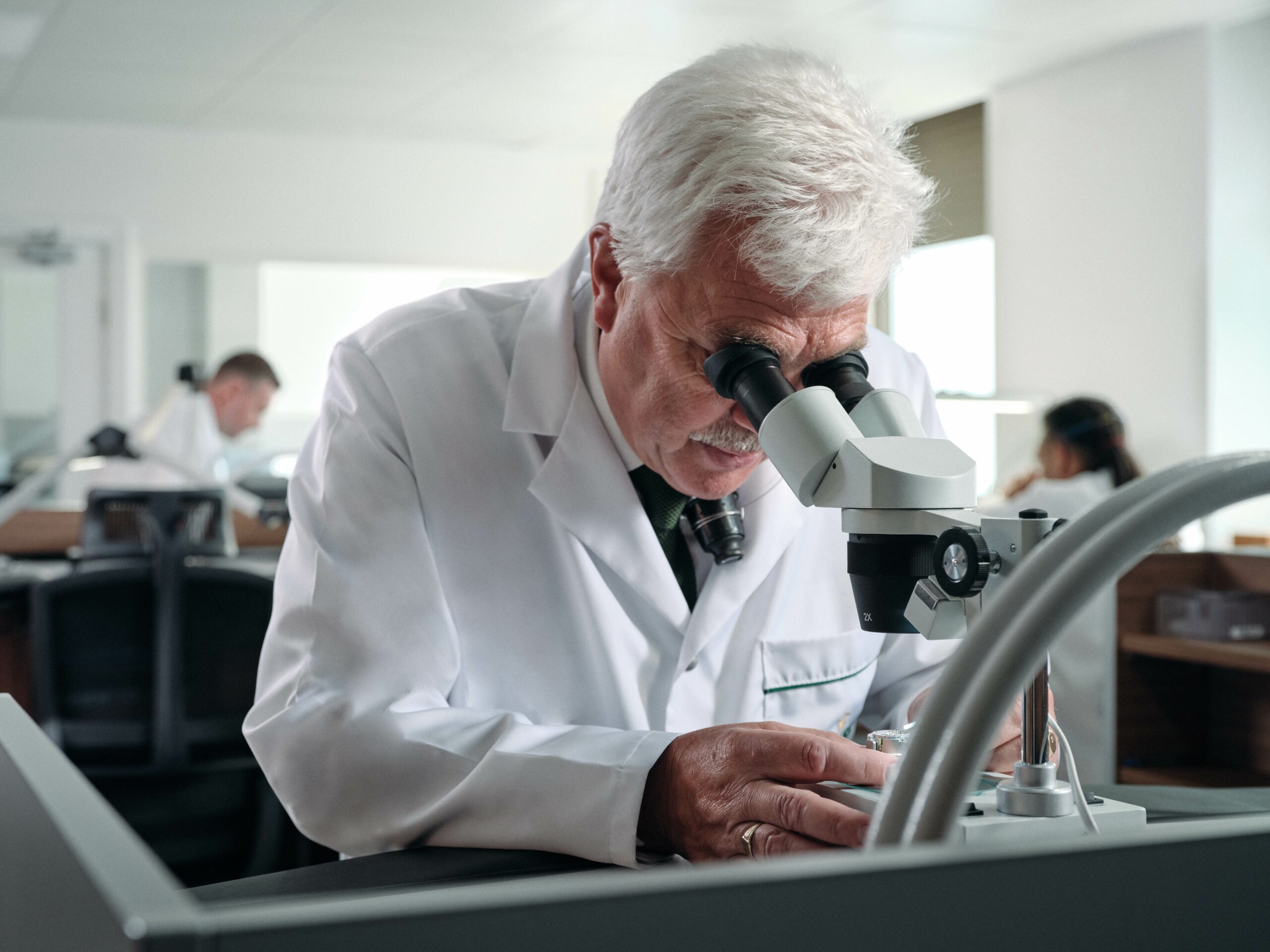 A watchmaker examining a watch at the whittles preston rolex authorised service centre scaled