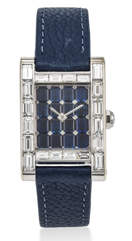 Lot 38 cartier. A possibly unique and opulent 18k white gold and baguette diamond set rectangular wristwatch